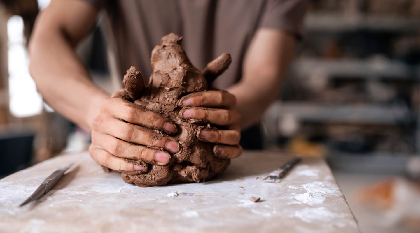 front-view-man-clay-sculpting 1 (1) (1)