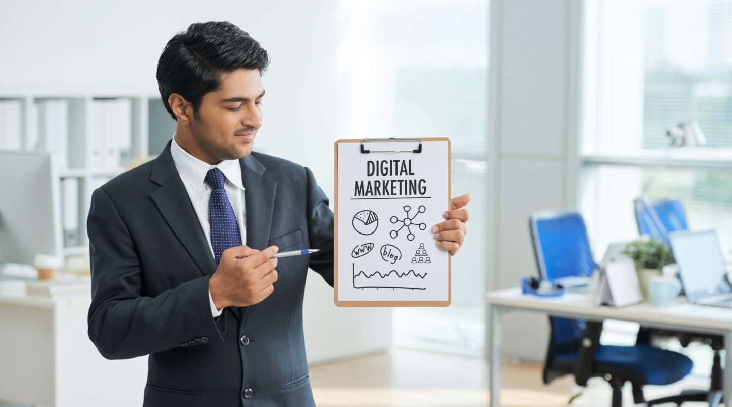 man-suit-standing-office-with-clipboard-pointing-poster-with-words 1 (1)